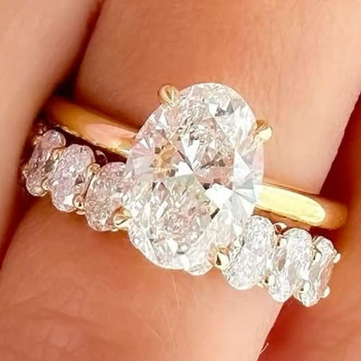 2.5 Carat Oval Lab Grown Diamond with plain band and Eternity Band with Oval Diamonds in 14K/18KY Gold setting
